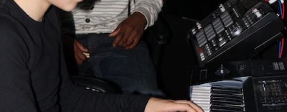 Young Justin B. playing keys