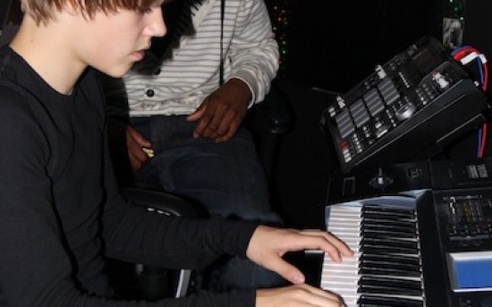 Young Justin B. playing keys